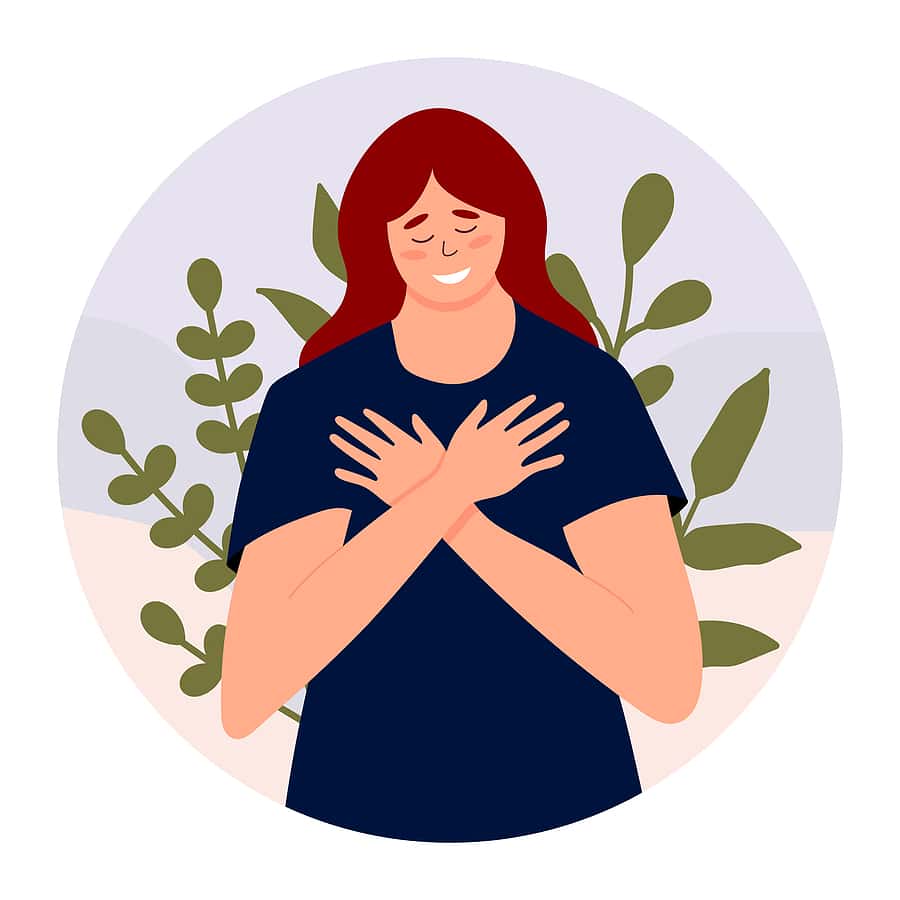 woman hugging herself