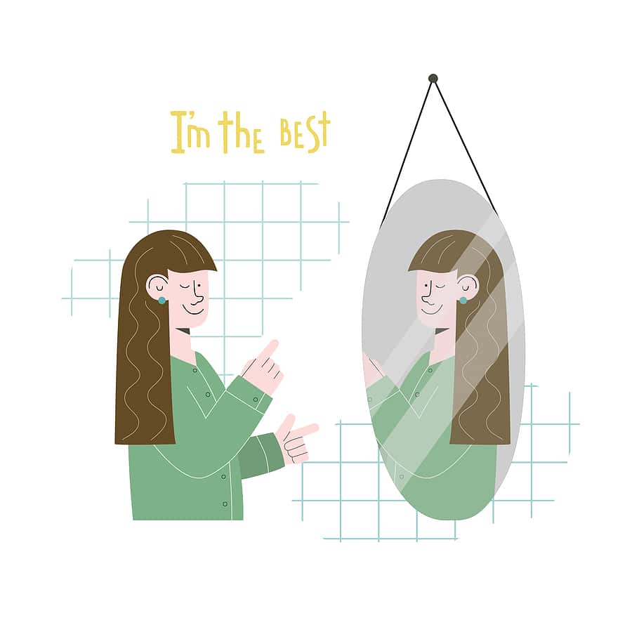 woman doing some affirmations in the mirror