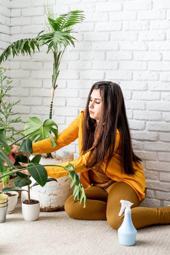 woman taking care of her plants
