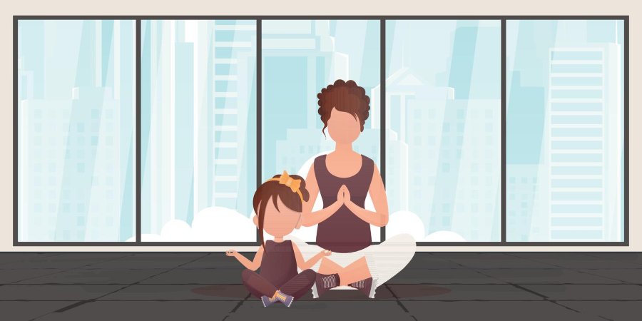 Mom and toddler girl meditating together