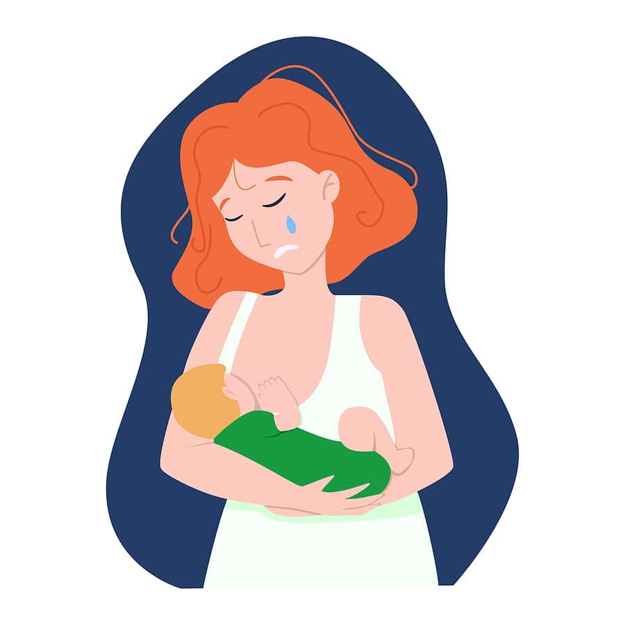 Mom crying while holding her baby