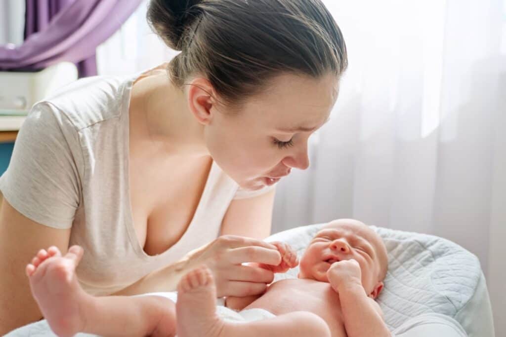 mom looking over her baby