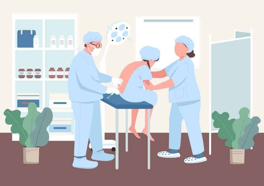 Woman getting an epidural in her back
