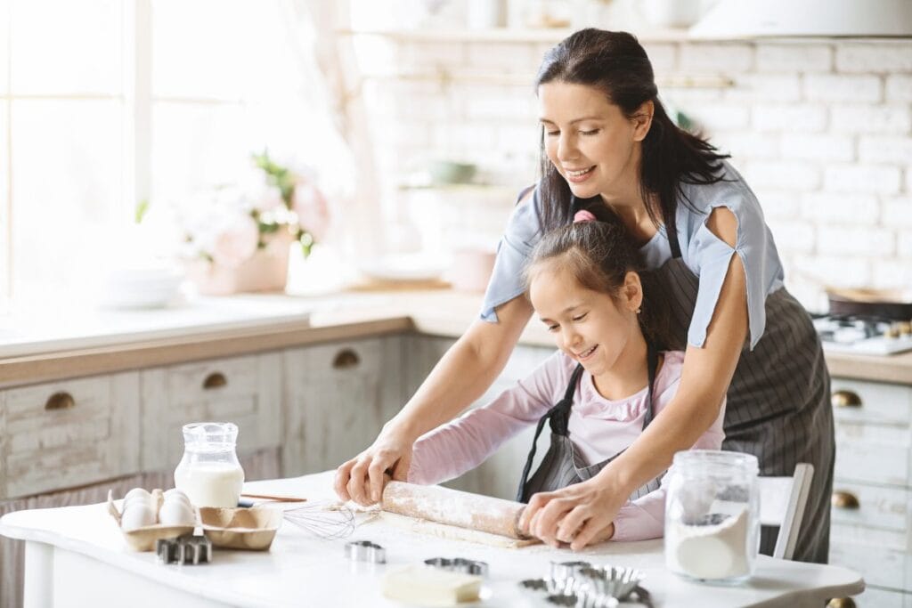 Mom and daughter baking cookies