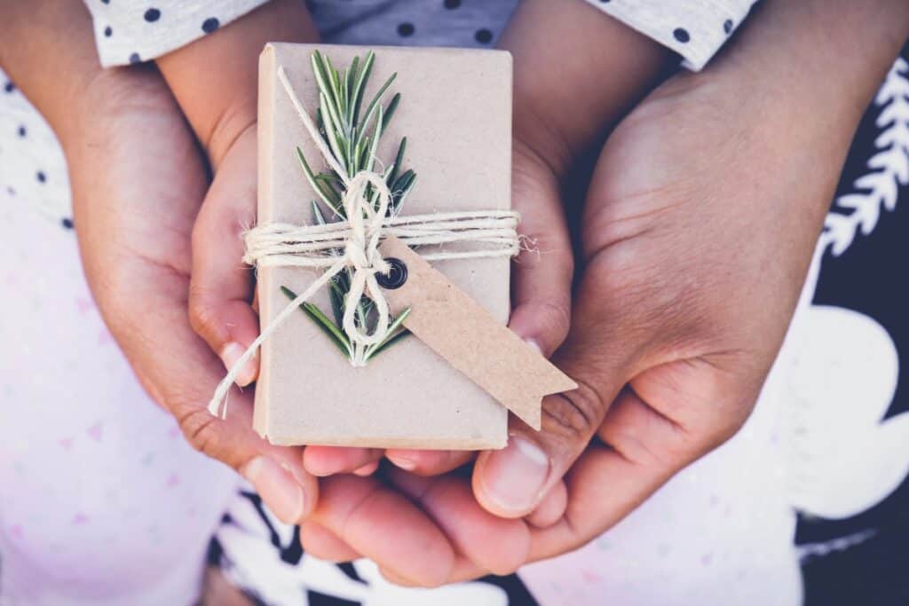 mom and child having with a present in their hands