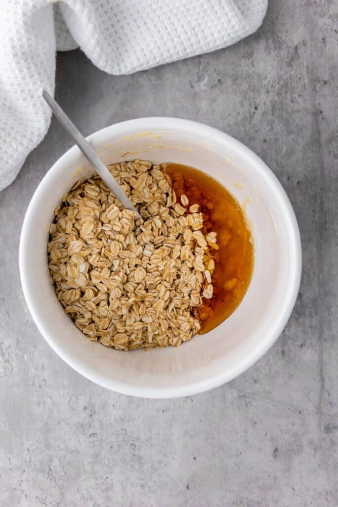 oats and honey in mashed banana bowl