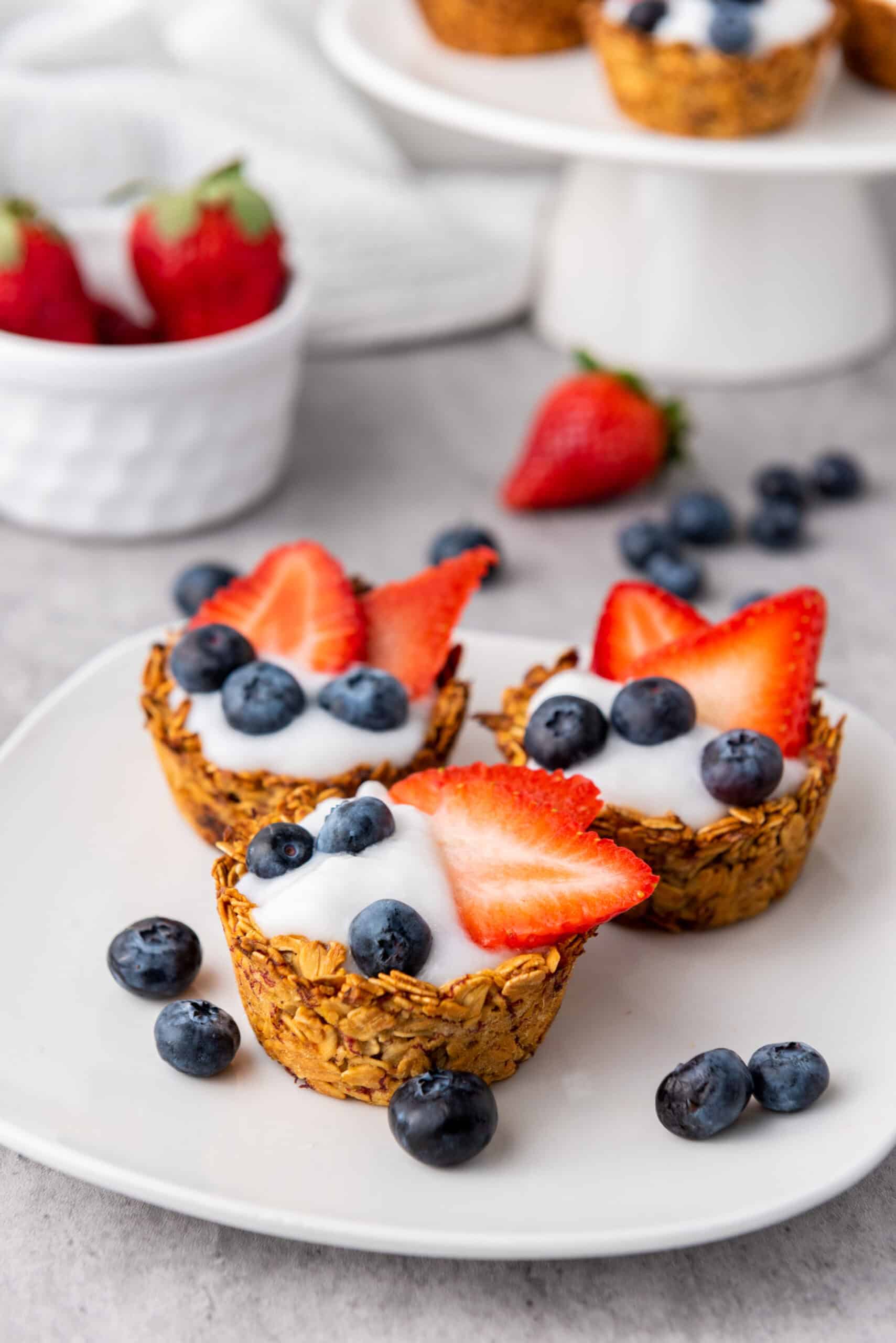 Granola Berry Cups topped with blueberries and strawberry