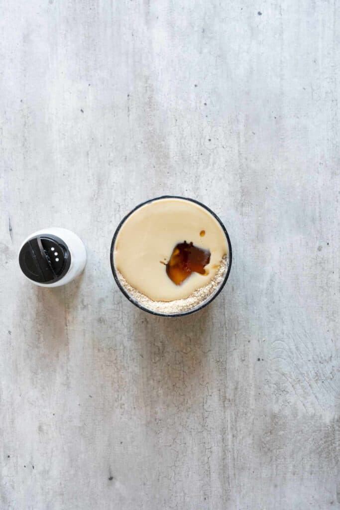adding maple syrup in the blender