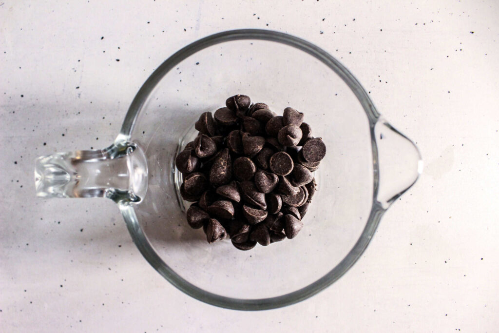 Chocolate chips in a glass bowl ready for melting