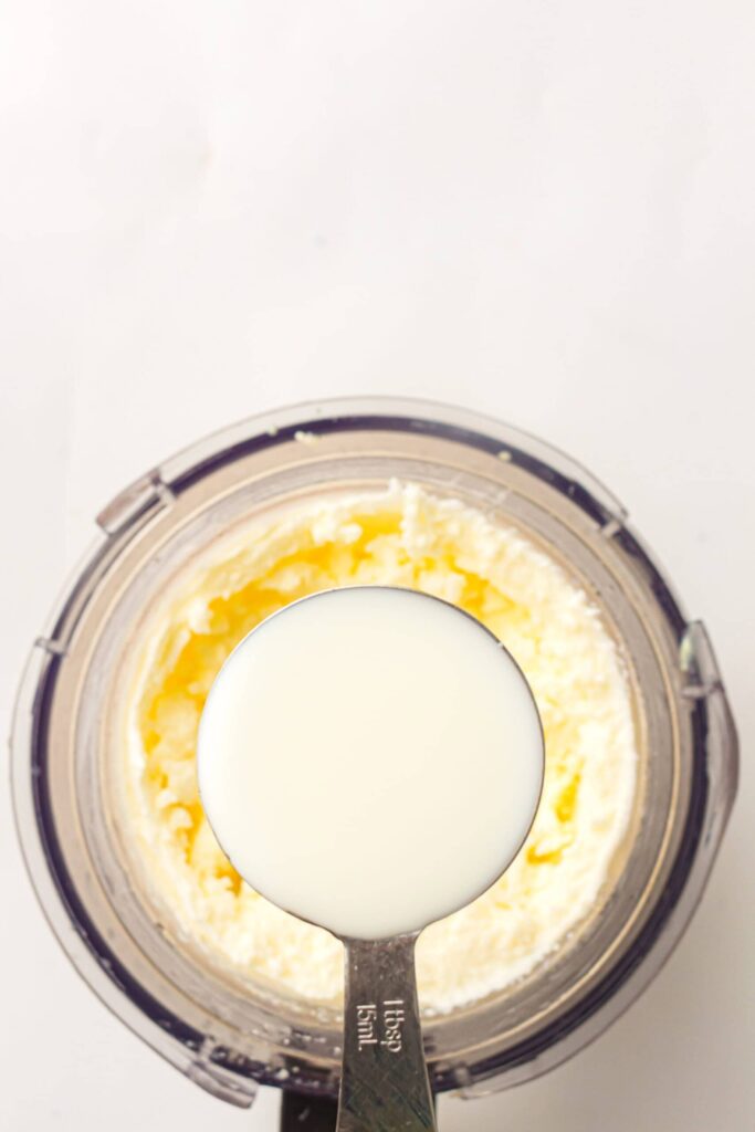 Adding a splash of milk to the ice cream mixture to improve texture.